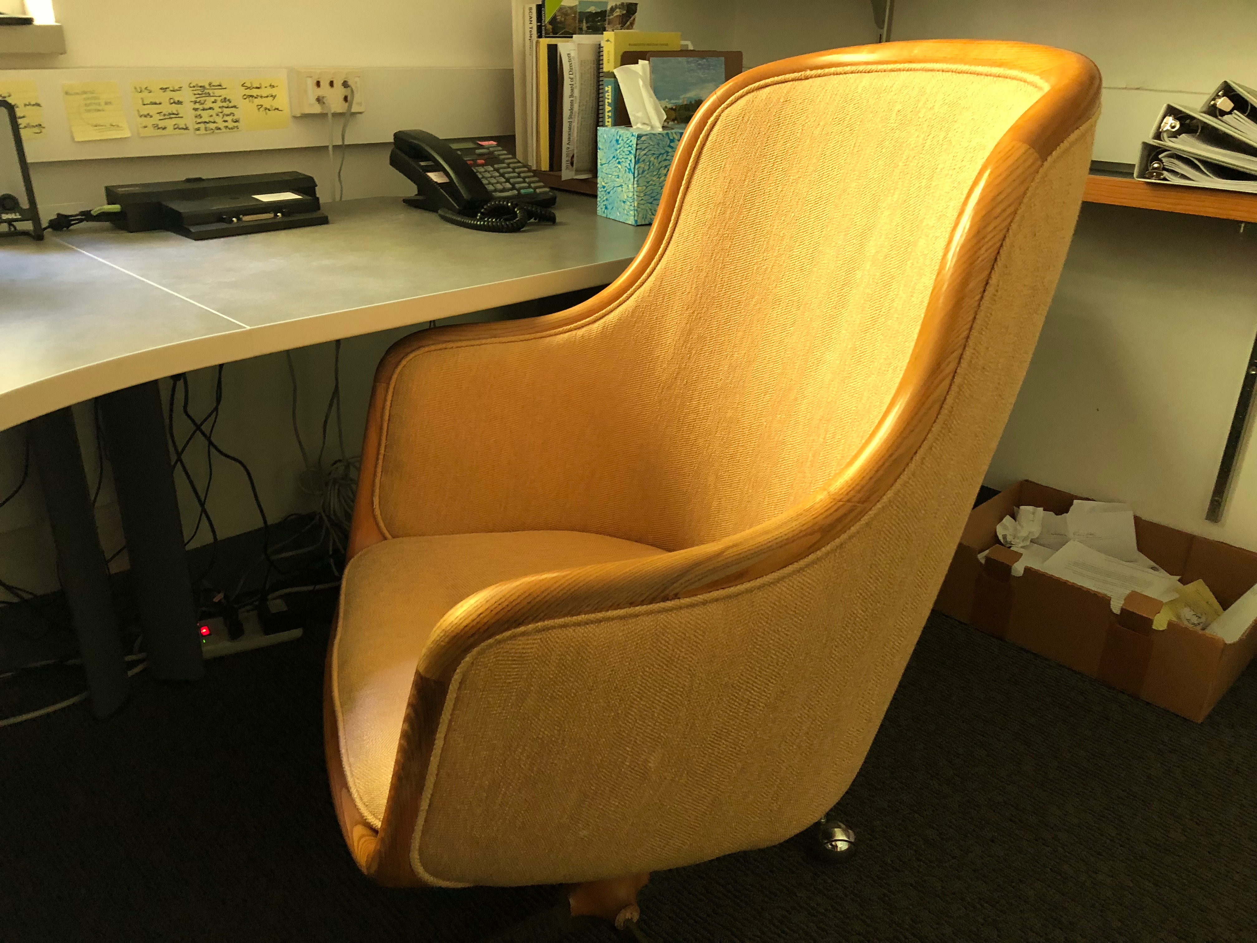 a 1980s-style yellow upholstered desk chair