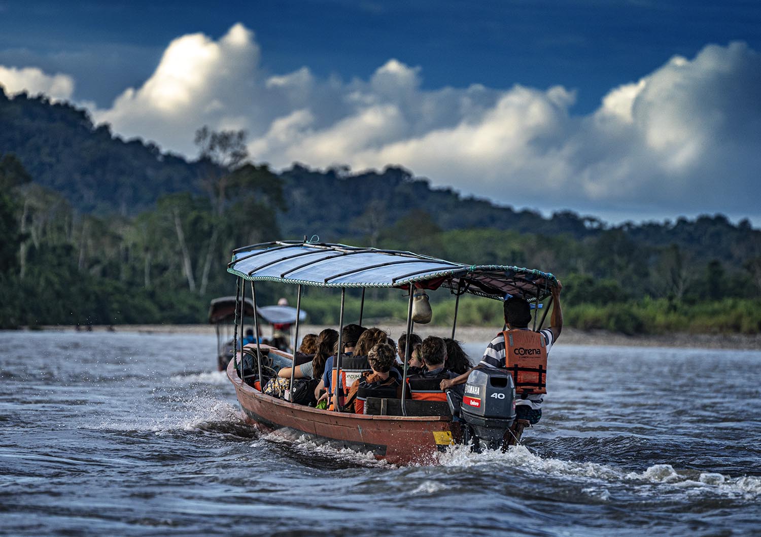 The Western group split across two motor boats, setting out on the Amazon river