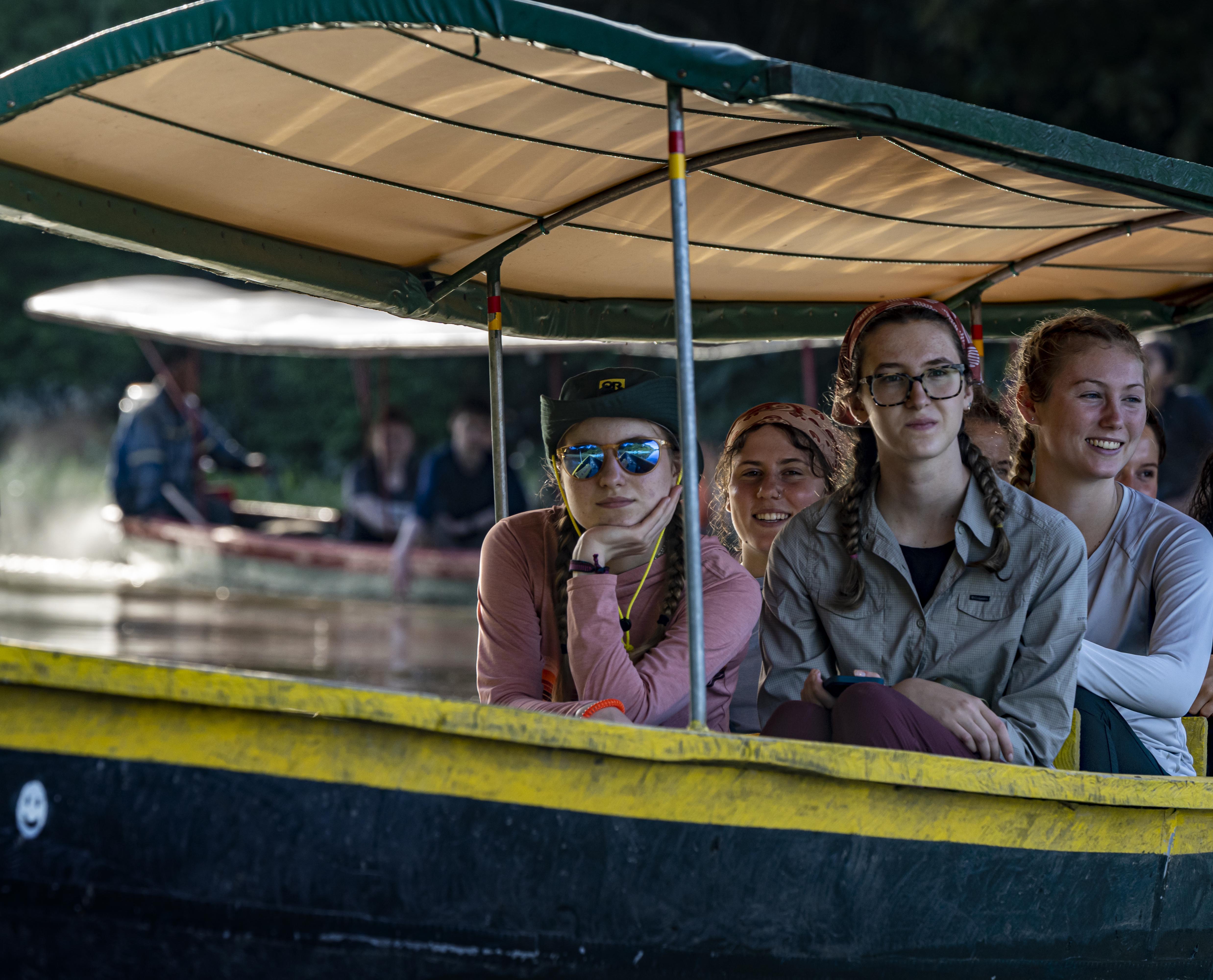 A group of Western students in a boat