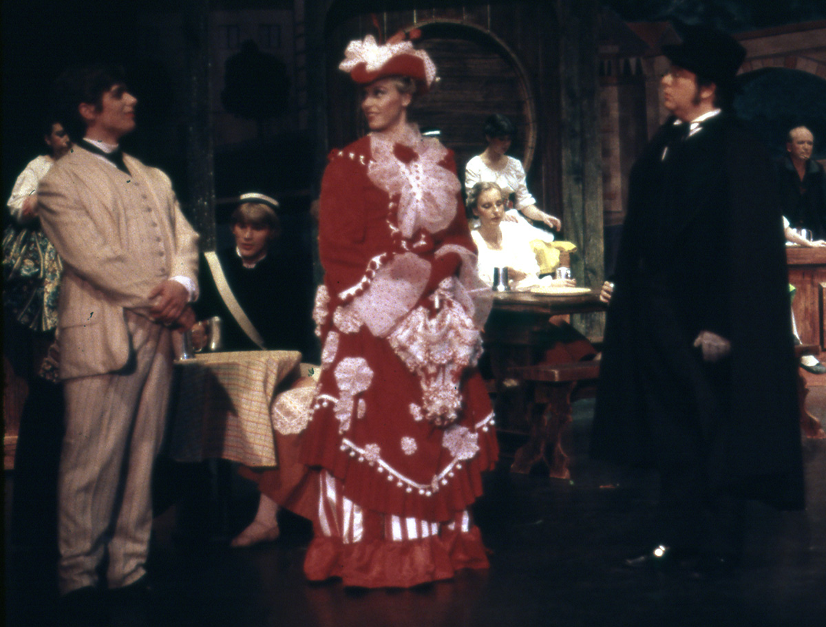 Students in costume perform in a scene from The Student Prince, set in an 18th century German pub 
