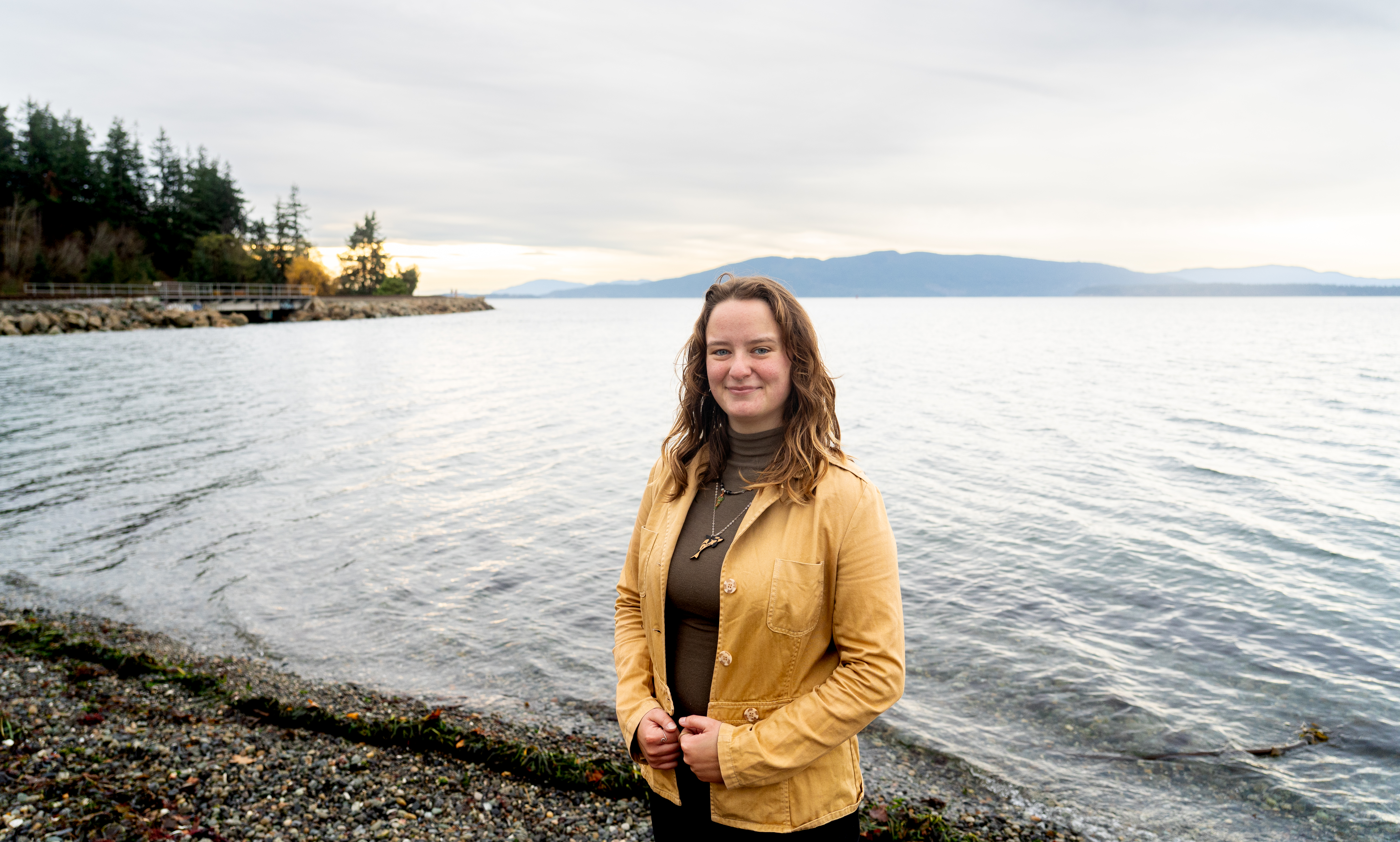 Caitlyn Blair stands along the shore of Bellingham Bay