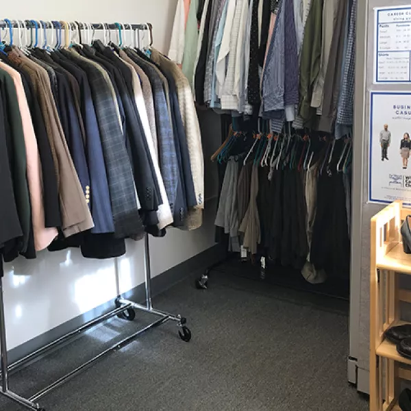 blazers and other business attire hung in neat rows 