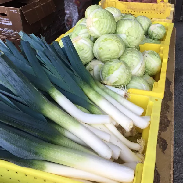 crates of leeks and cabbage 