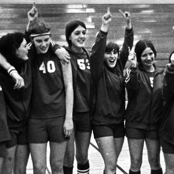 Western's women's basketball team celebrates on the court in 1972-73