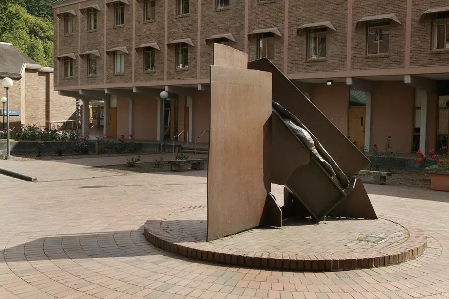 India by Anthony Caro features flat slabs and organic-looking lumps of rusted and varnished steel.
