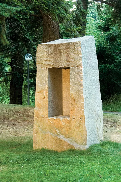 A block of granite with a rectangular-shaped void removed from one side