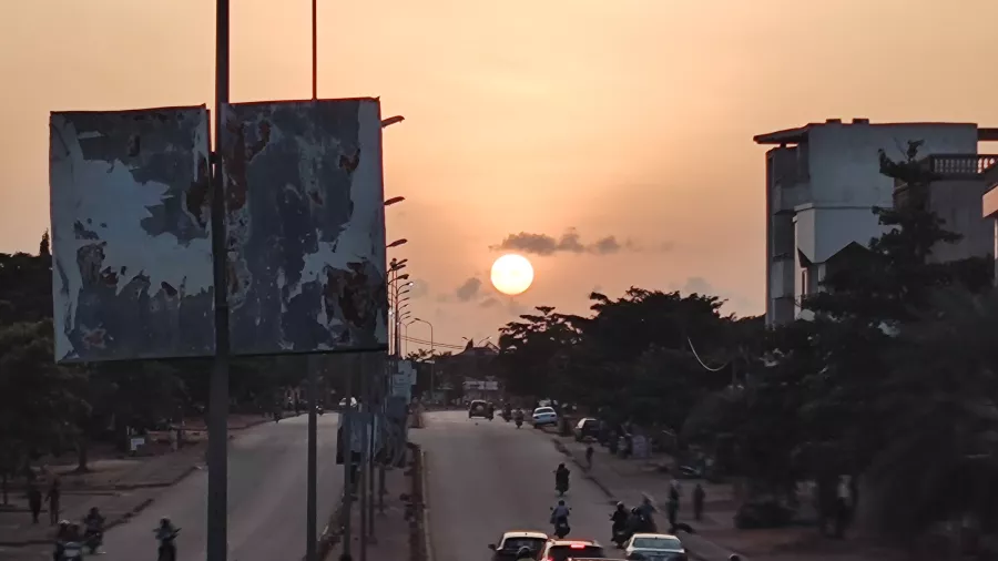 the sun sets over the buildings of Porto Novo, Benin. 