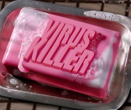 photo illustration depicting a bar of soap with the words &quot;VIRUS KILLER&quot; imprinted on the top