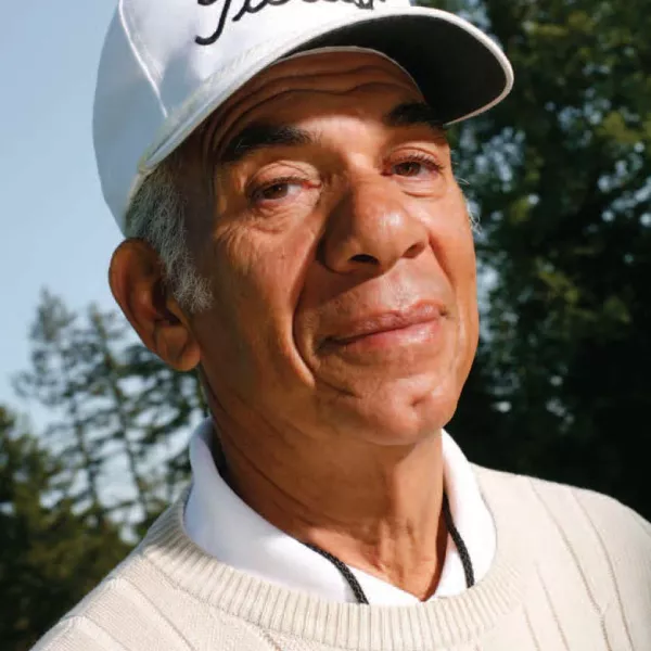 Bill Wright in a white Titleist baseball cap, white sweater and white collared shirt
